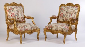 Pair of oversized giltwood carved Louis XV-style armchairs. Kamelot Auctions image